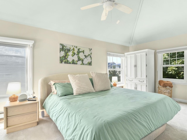 bedroom featuring ceiling fan, light colored carpet, and high vaulted ceiling