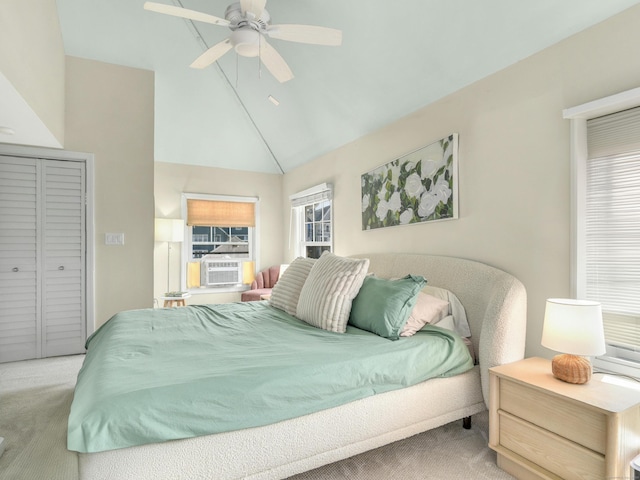 bedroom with carpet flooring, ceiling fan, cooling unit, a closet, and high vaulted ceiling