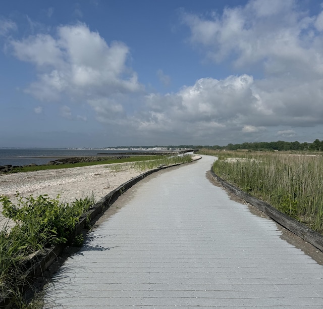 surrounding community with a water view