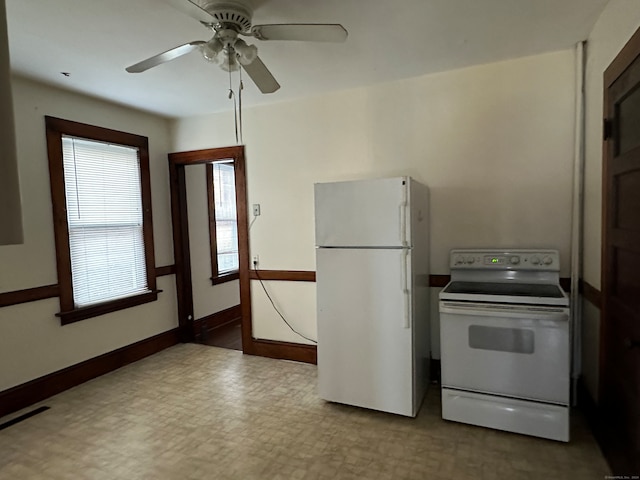 kitchen featuring white appliances and ceiling fan