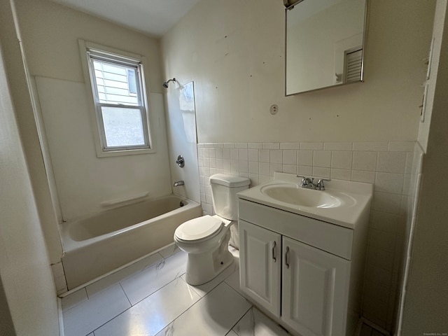 full bathroom featuring shower / tub combination, vanity, toilet, and tile patterned flooring