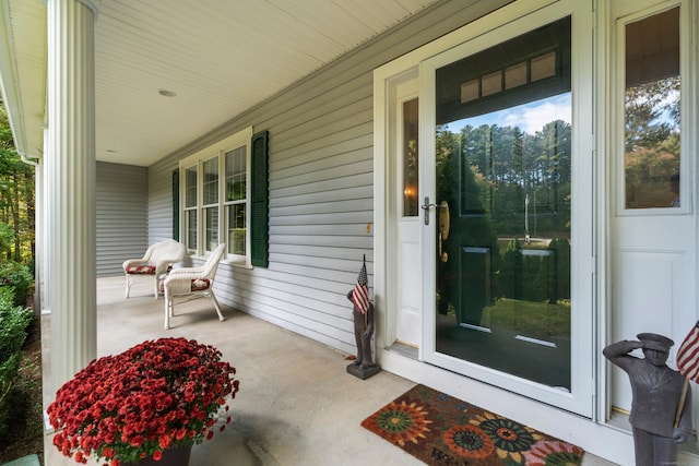 doorway to property with covered porch