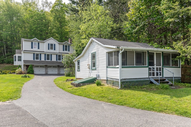 view of front facade featuring a garage and a front yard