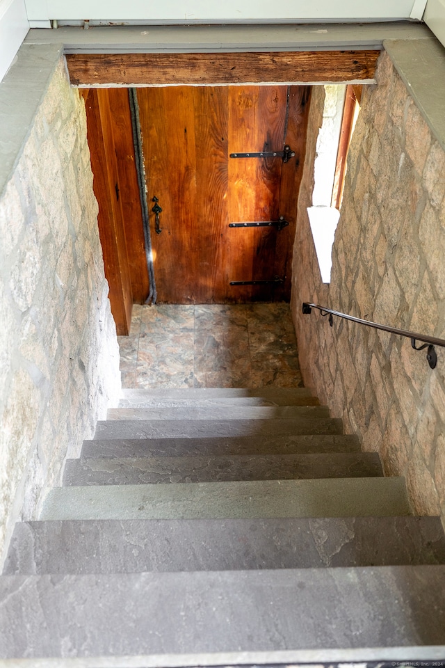 staircase featuring tile flooring