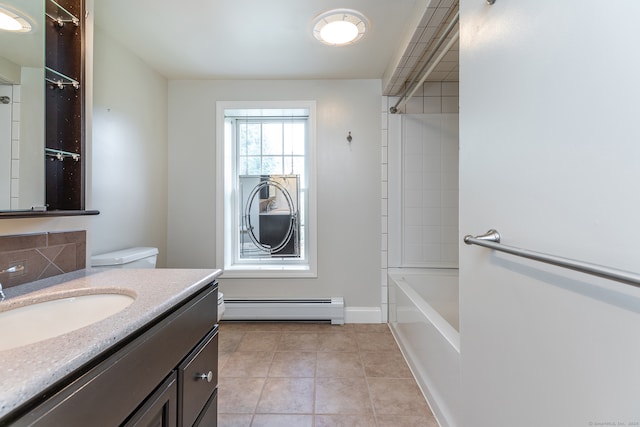 full bathroom with tile flooring, tiled shower / bath, a baseboard heating unit, toilet, and vanity