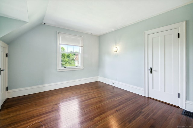 bonus room featuring dark hardwood / wood-style flooring and lofted ceiling