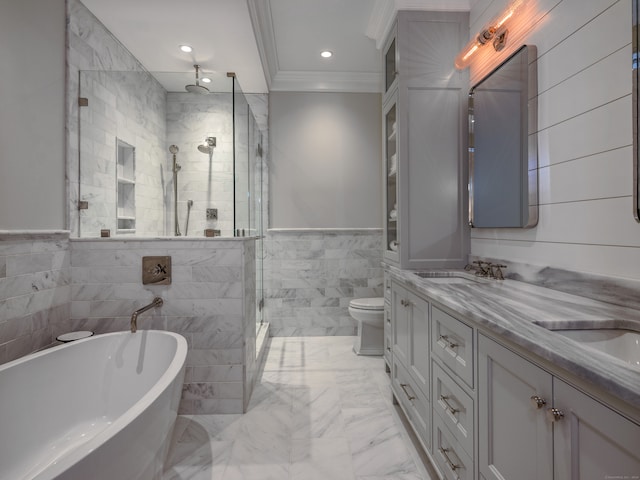 full bathroom with crown molding, double sink vanity, tile walls, tile floors, and toilet