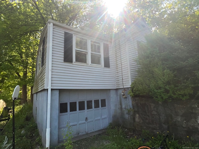 view of side of property featuring a garage