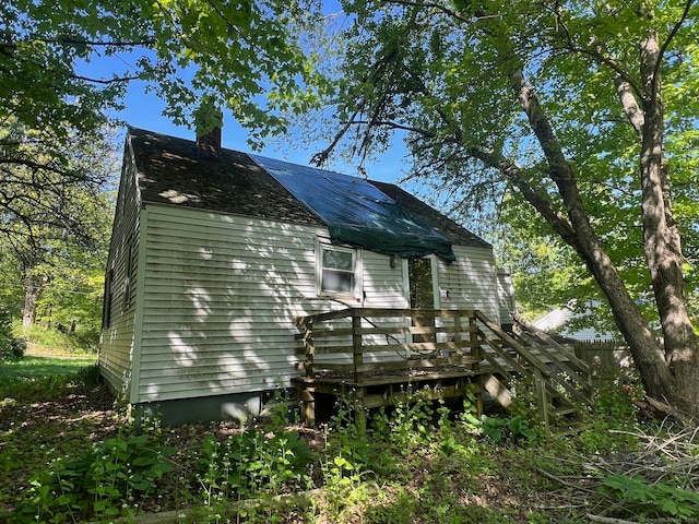 view of side of property with a deck