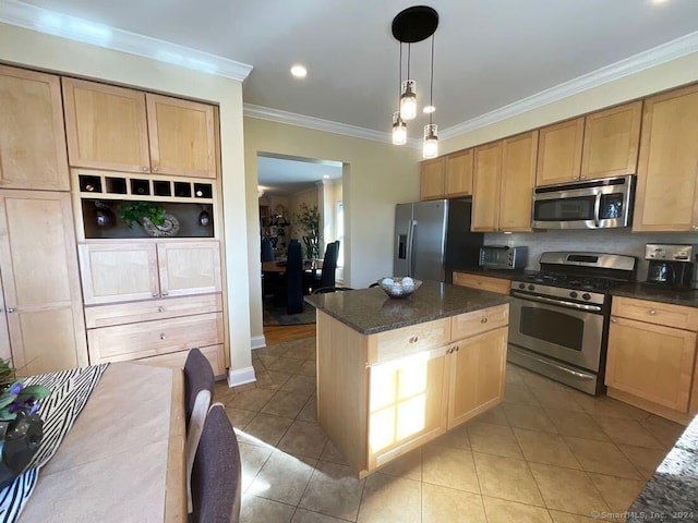 kitchen with hanging light fixtures, a center island, light tile patterned floors, stainless steel appliances, and crown molding