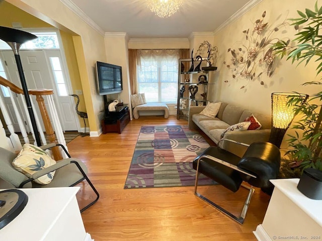 living room featuring crown molding and light hardwood / wood-style floors