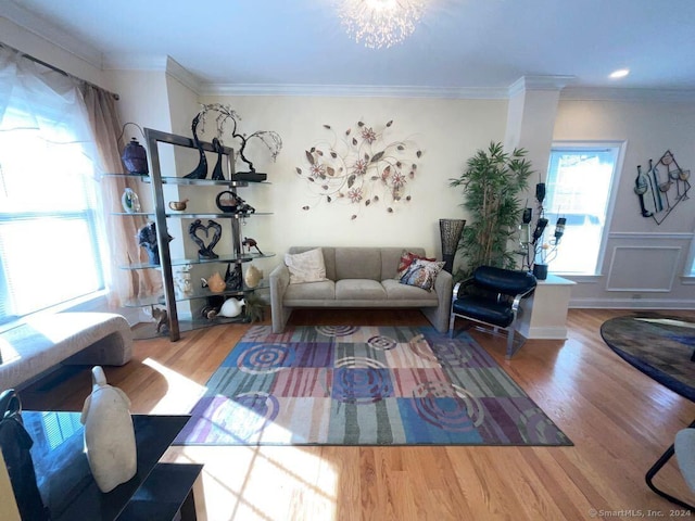 living room with ornamental molding and hardwood / wood-style floors