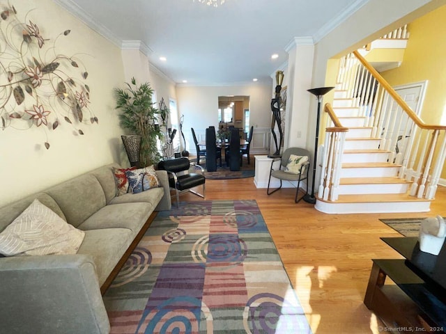 living room featuring hardwood / wood-style floors and ornamental molding