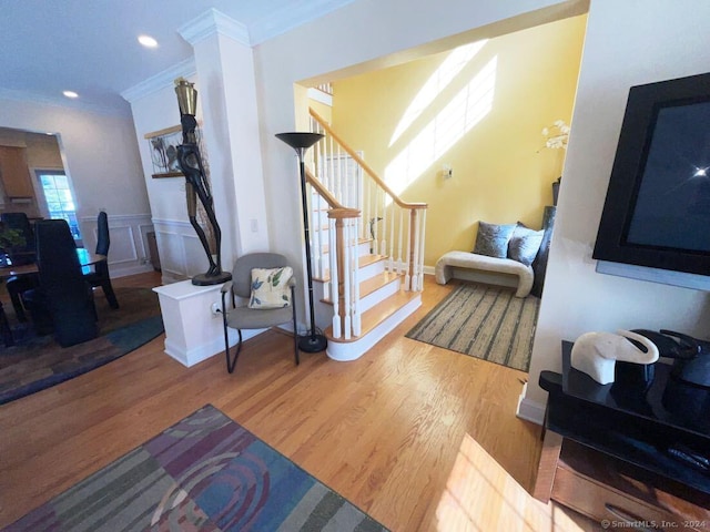 living room with ornamental molding and hardwood / wood-style floors