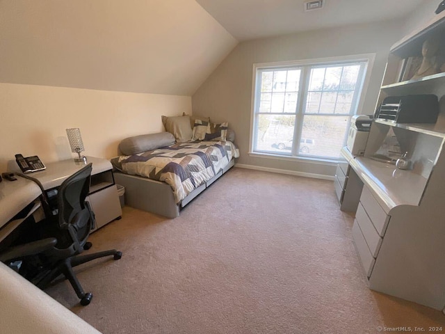 carpeted bedroom featuring lofted ceiling