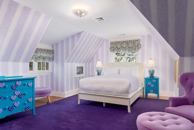 bedroom featuring carpet flooring and lofted ceiling