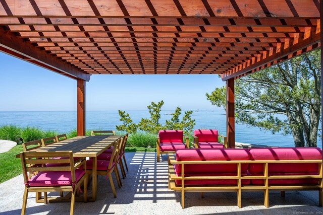 view of patio with a pergola, an outdoor hangout area, and a water view