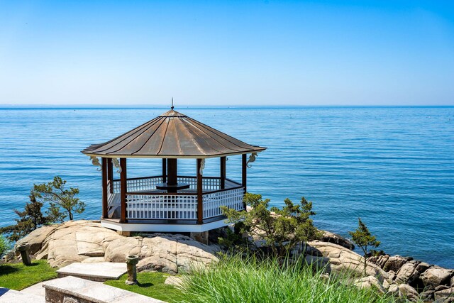 view of dock featuring a water view and a gazebo