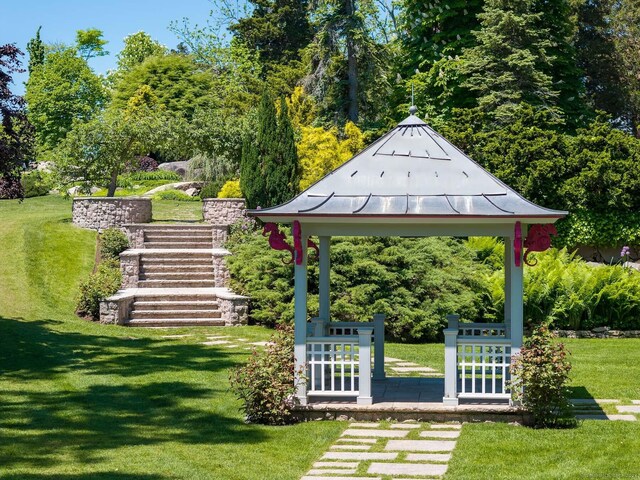 surrounding community with a lawn and a gazebo