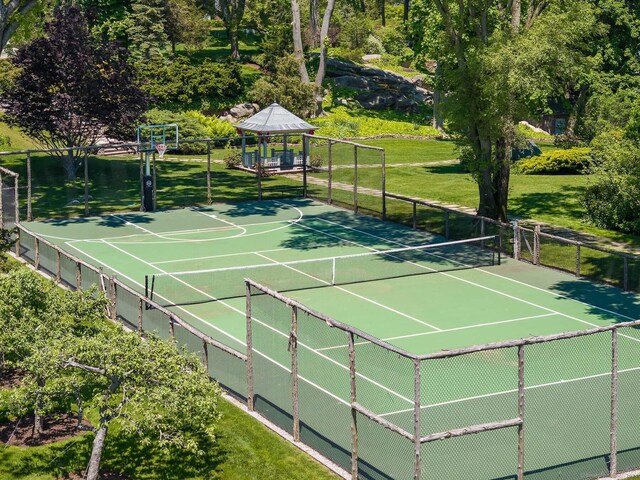 view of tennis court featuring a gazebo