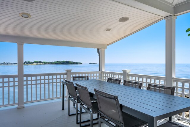 wooden terrace with a water view