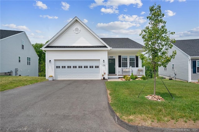 view of front of home with a garage and a front yard