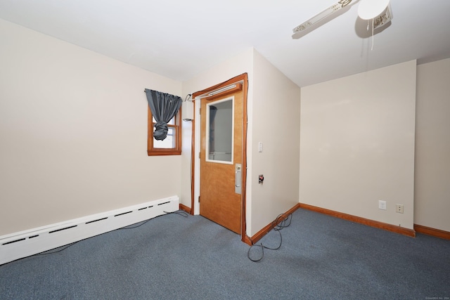 carpeted spare room with baseboard heating and ceiling fan