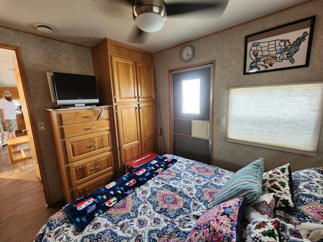 bedroom featuring wood-type flooring and ceiling fan