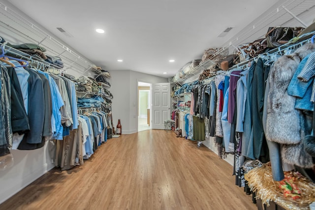 spacious closet featuring hardwood / wood-style floors