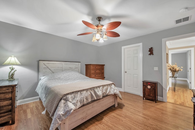 bedroom with light wood-type flooring and ceiling fan