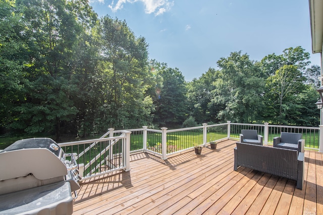 deck featuring outdoor lounge area and a grill