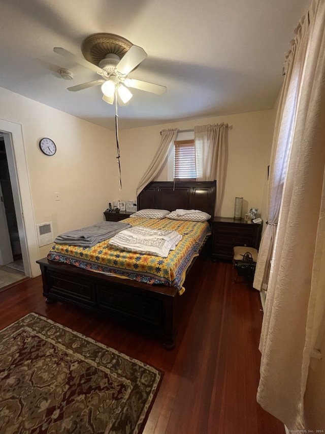 bedroom featuring ceiling fan and hardwood / wood-style flooring