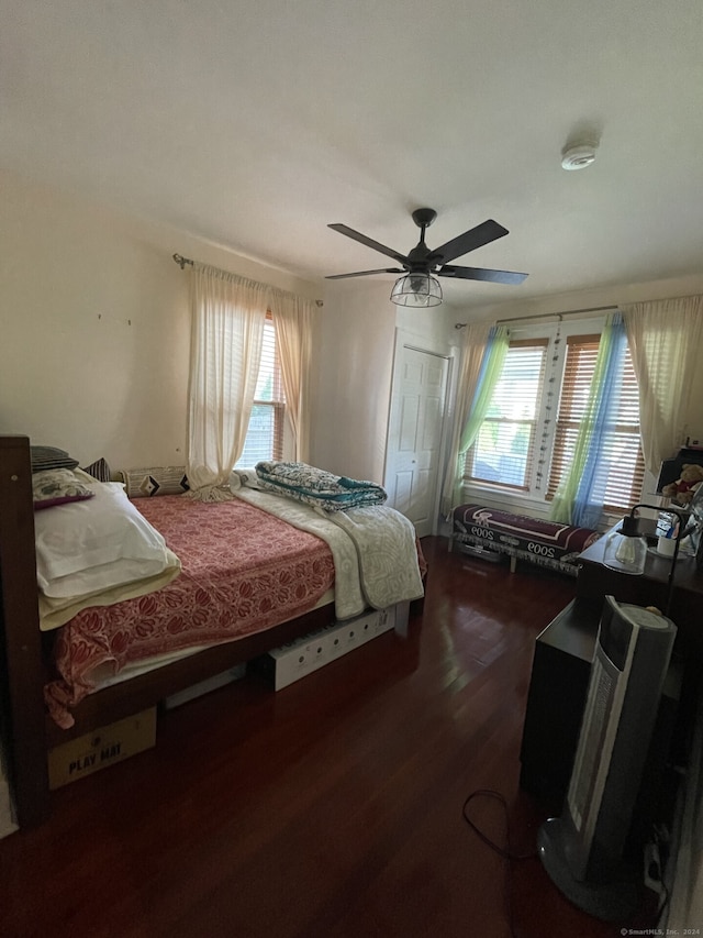 bedroom featuring a closet, ceiling fan, and wood-type flooring