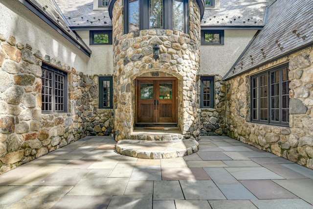 property entrance featuring french doors