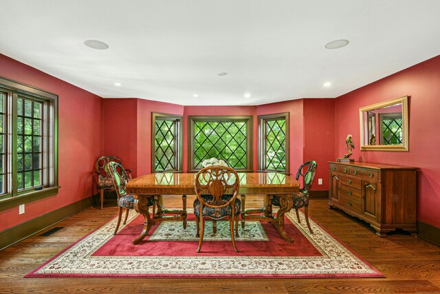 dining area featuring dark wood-type flooring