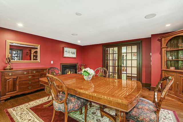 dining area featuring dark hardwood / wood-style flooring and french doors