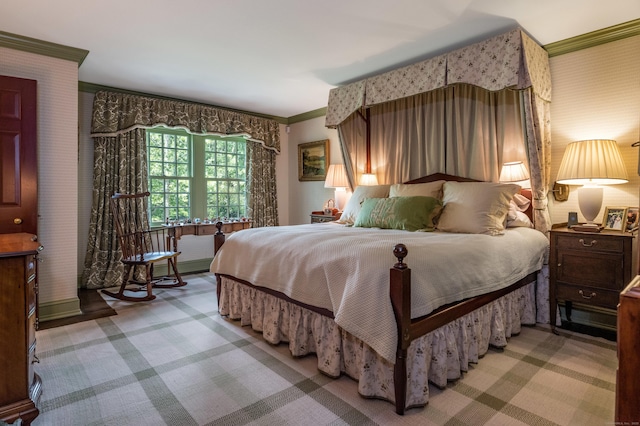 carpeted bedroom with ornamental molding