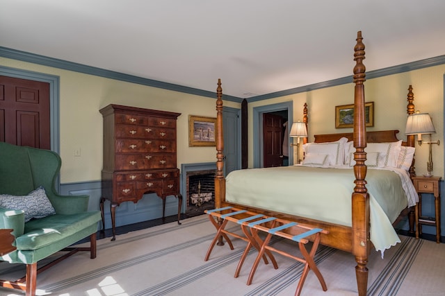 carpeted bedroom with ornamental molding