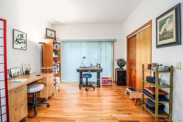 office with light wood-type flooring