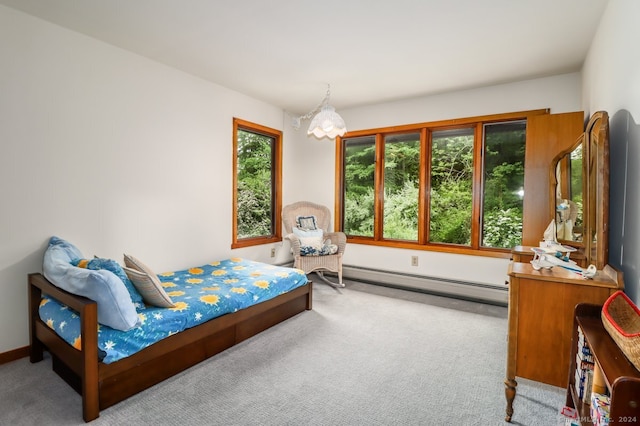 carpeted bedroom with multiple windows, baseboard heating, and a notable chandelier