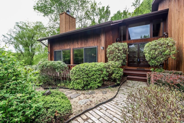 rear view of property with french doors