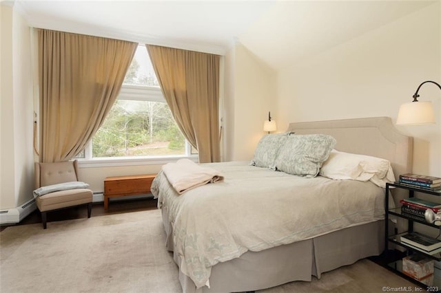 carpeted bedroom with a baseboard heating unit