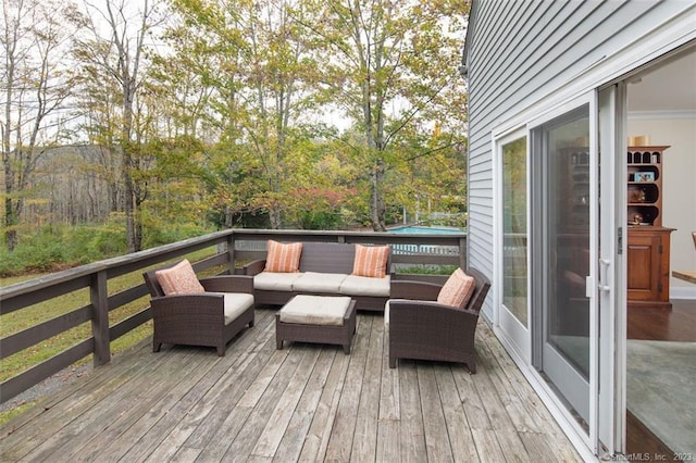 deck featuring outdoor lounge area