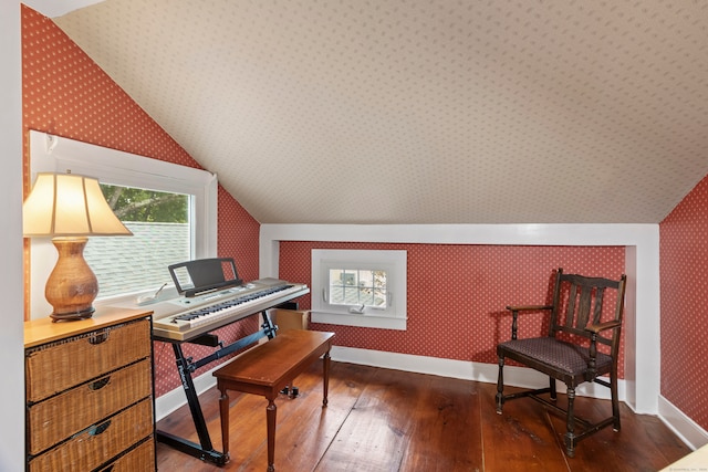 interior space with vaulted ceiling and hardwood / wood-style floors