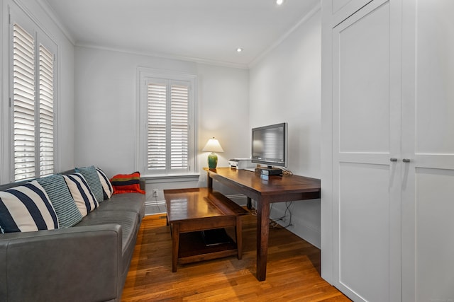 office area with plenty of natural light and dark hardwood / wood-style flooring