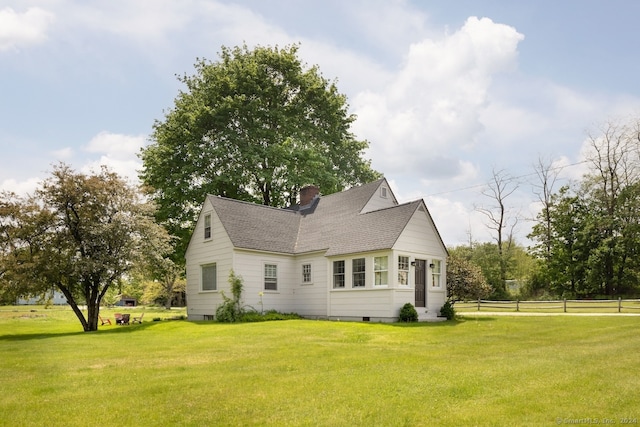 view of home's exterior featuring a yard