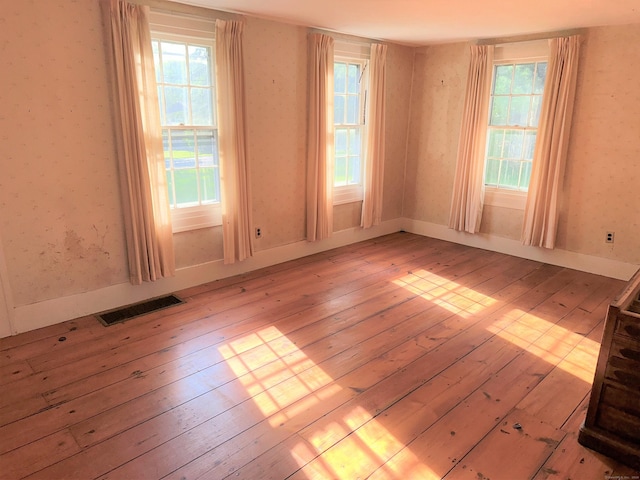 unfurnished room featuring light hardwood / wood-style flooring