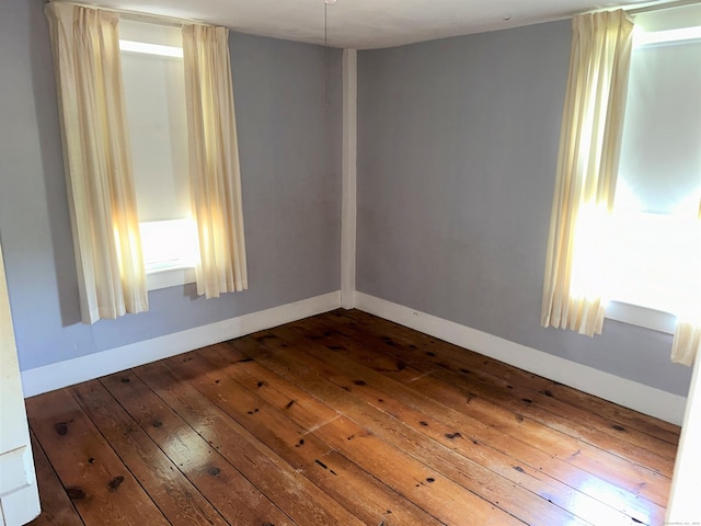 spare room featuring hardwood / wood-style flooring