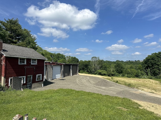 view of yard with a garage