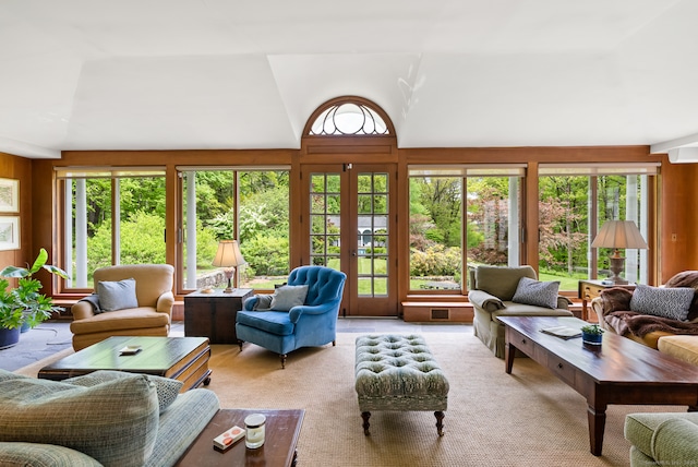 living room featuring french doors and lofted ceiling